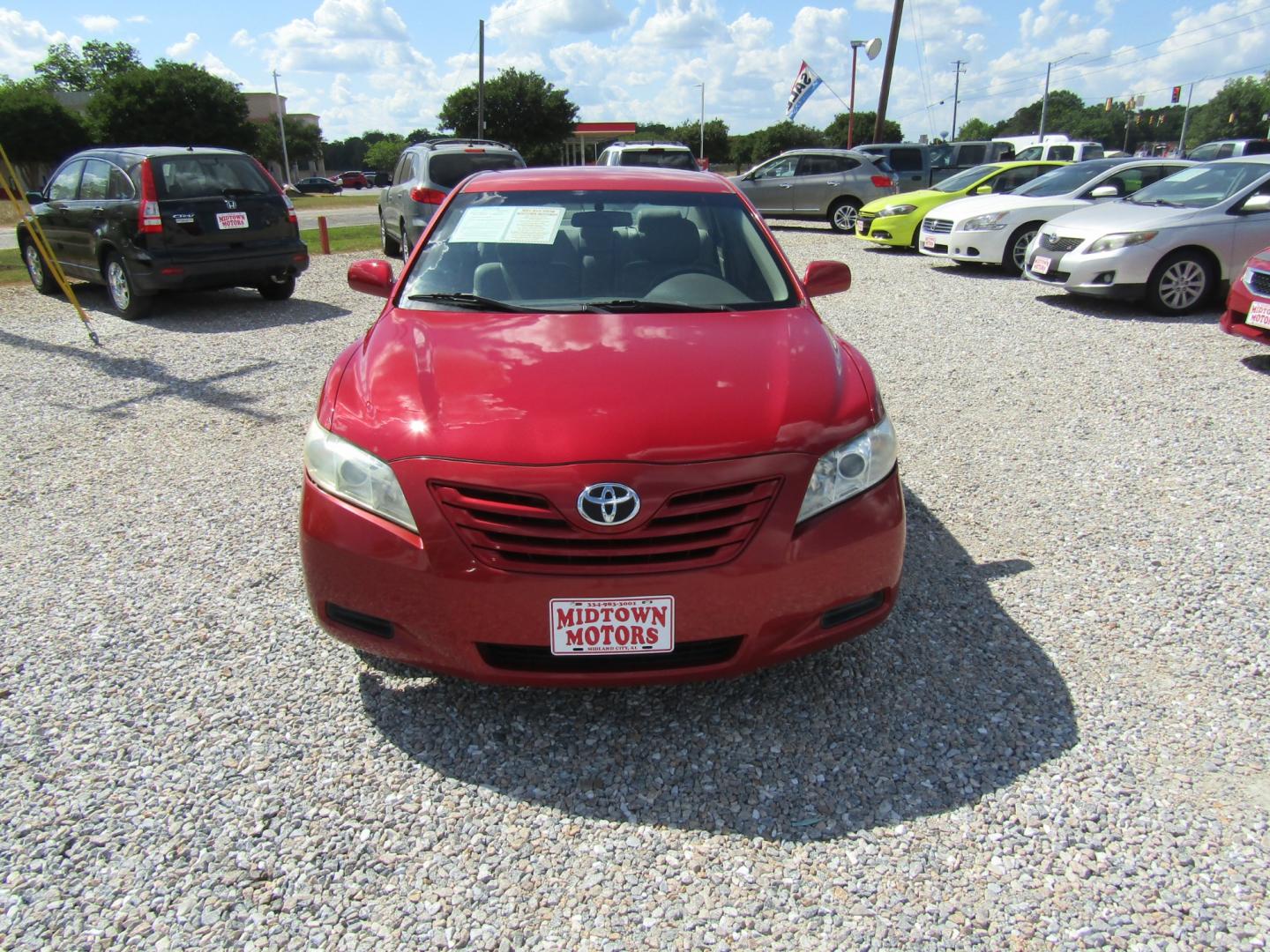 2007 Red /Tan Toyota Camry (4T1BK46K97U) with an 4 CYL engine, Automatic transmission, located at 15016 S Hwy 231, Midland City, AL, 36350, (334) 983-3001, 31.306210, -85.495277 - Photo#1